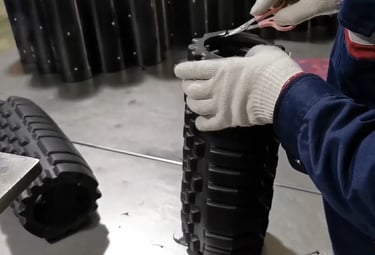 Core tube inserted into foam roller during assembly process
