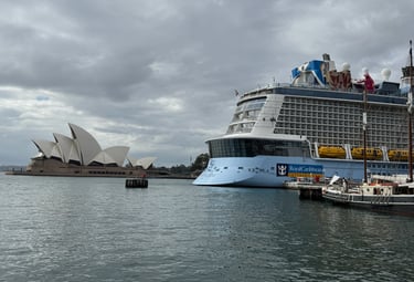 Royal Caribbean Quantum of the Seas docked in Sydney with Sydney Opera House in the background