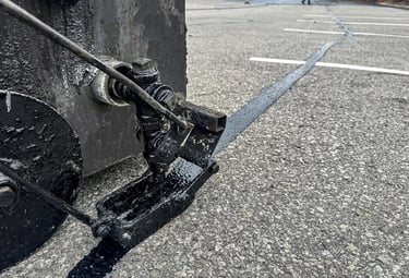 Professionally sealing parking lot cracks to avoid further damage and breakdown