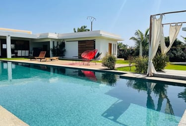 a pool with a red chair and a red chair
