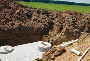 septic system in ground by dirt pile