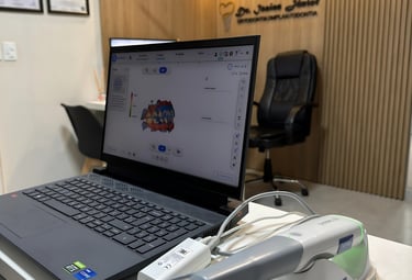 a laptop computer sitting on a table with a laptop and a mouse