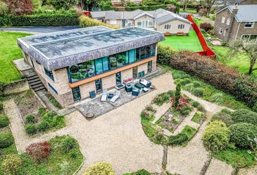 a house with a large garden photographed by a drone