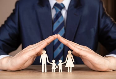 a man in a suit and tie holding hands in front of a family