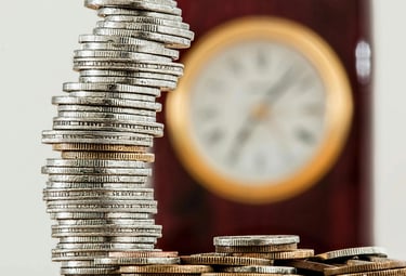 a stack of coins sitting on top of a pile of coins