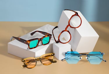 a variety of sunglasses and sunglasses on a table