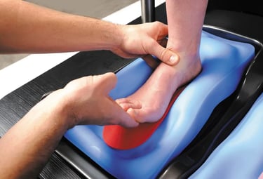 Close-up of a bike fitter forming custom insoles.