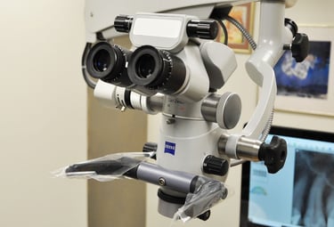 Professional Zeiss dental microscope used for precision endodontic procedures in a modern clinic.