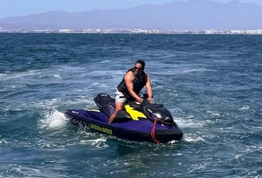 a man riding a jet ski in the ocean