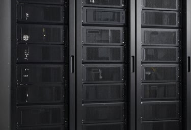 Technicians monitoring liquid cooling systems in a bright, eco-friendly data center.