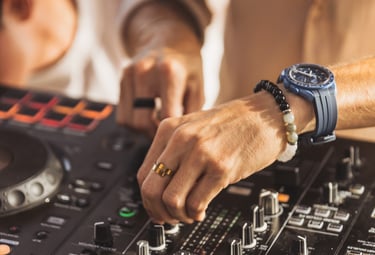 Close-up of DJ Miguel Cuartín performing a deep afro house set during the SOLÉ sunset journey.
