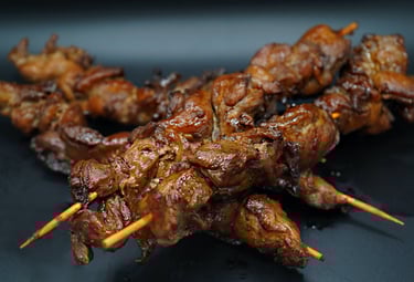 4 Grilled Teryaki Chicken Kabobs with 2 in the background and 2 in the foreground,