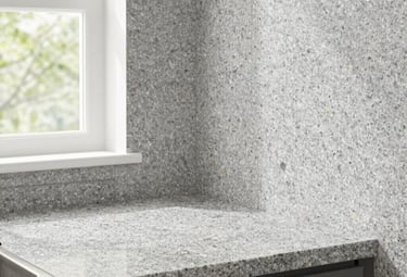 Spray granite finish on kitchen worktop and splashback wall