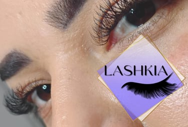 Close-up of a woman's eyes with professional volume eyelash extensions and defined eyebrows.