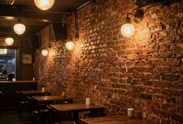 An atmospheric interior view of a brick-walled music venue in Buenos Aires inspired by the classic British clubs, featuring warm amber lighting and a nostalgic Argentine cultural vibe.
