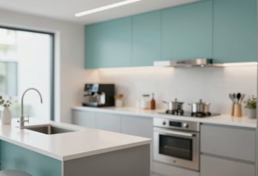 A modern, well-equipped communal kitchen with clean countertops and stainless steel appliances. A small coffee station is visible. Lighting is bright and clean. Incorporates brand colors #A7C2C3 and #F5F8F7.