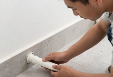 Close-up of a technician cleaning a radiator with specialized equipment.