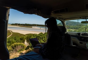 a woman sitting in the back of a van