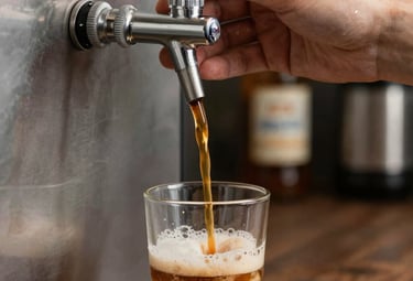 Tall glass of cold brew coffee with ice cubes and condensation on the glass.