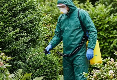 Waso nest removal expert preparing to perform treatment near a bush