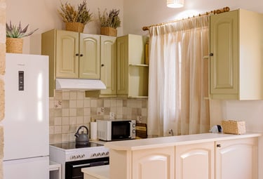A kitchen with a refrigerator, microwave, and oven | Tonia's Cottage
