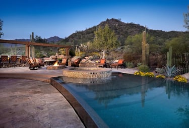a pool with a fire pit and a fire pit