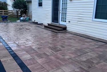 a patio with a brick patio with a brick patio