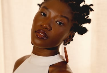 Portrait of a sun-kissed poet with a focused gaze—top Nigerian spoken word artist, reflecting raw cr