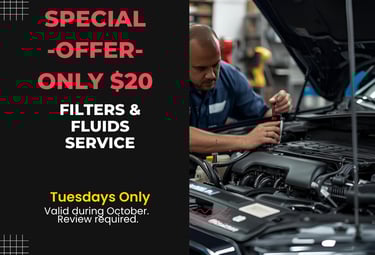 Mechanic changing oil and filters during Tuesday $20 Filters & Fluids Service at Fast Tire Shop East