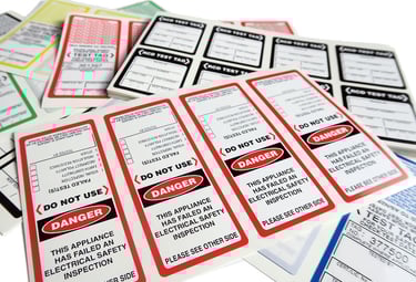 a bunch of labels on a table with a lot of labels