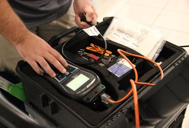 a man testing an electrical cable 