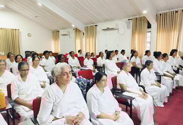 a group of people sitting in chairs in a room