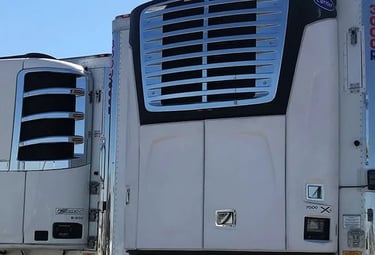 a truck with a large truck behind it