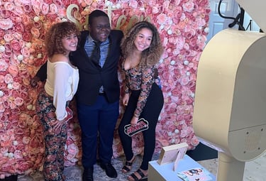 A group of teenagers using the studio photo booth