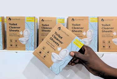 picking a box of ecomend toilet cleaner sheets from a shop