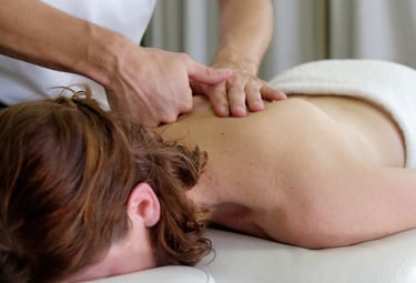 a woman getting a deep tissue massage treatment