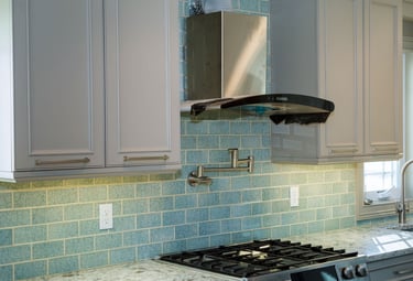 a kitchen remodelwith a new stove top and a stove top
