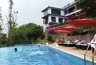 Relax by the pool whilst overlooking the Li River and Karst peaks