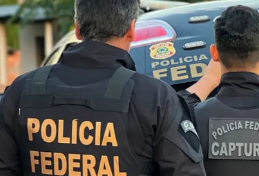 two police officers standing in front of a police car