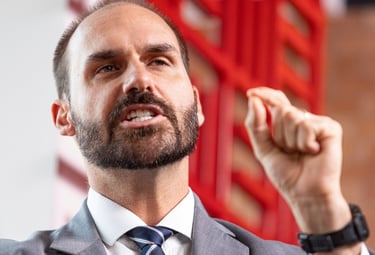 a man in a suit and tie is holding a microphone