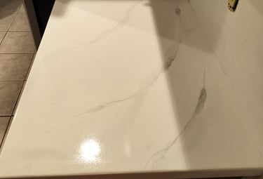 Custom white epoxy countertop with marble-style veining – seamless, glossy finish ideal for kitchens
