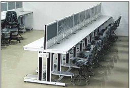 Modern call center workstation desks with privacy screens and ergonomic office chairs.