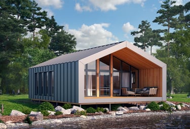 Modern prefab cabin with a metal roof and glass walls situated on a serene lakefront.