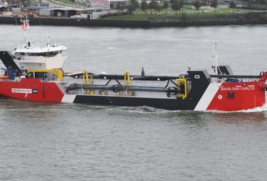 a boat with a red and white boat in the water