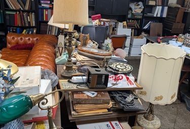 over filled room with miscellaneous items