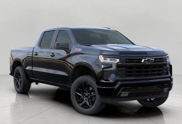 a black chevrolet silveradoo truck with a black and white background