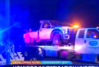 a truck with a police officer on it's back and a police officer on