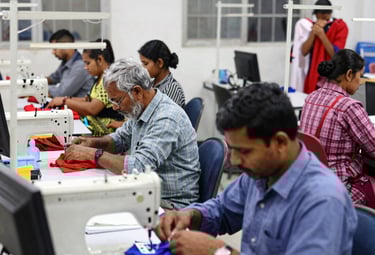 Close-up of fresh fish laid out on ice at a bustling fish market.