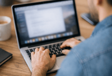 Maintaining code on a laptop.