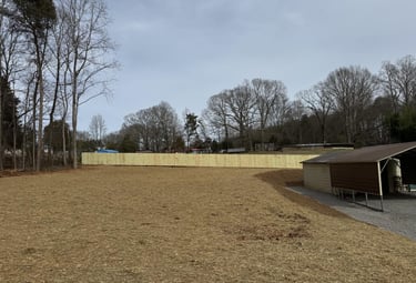 Expert site prep and soil grading to prevent water runoff and erosion for a North Carolina home.